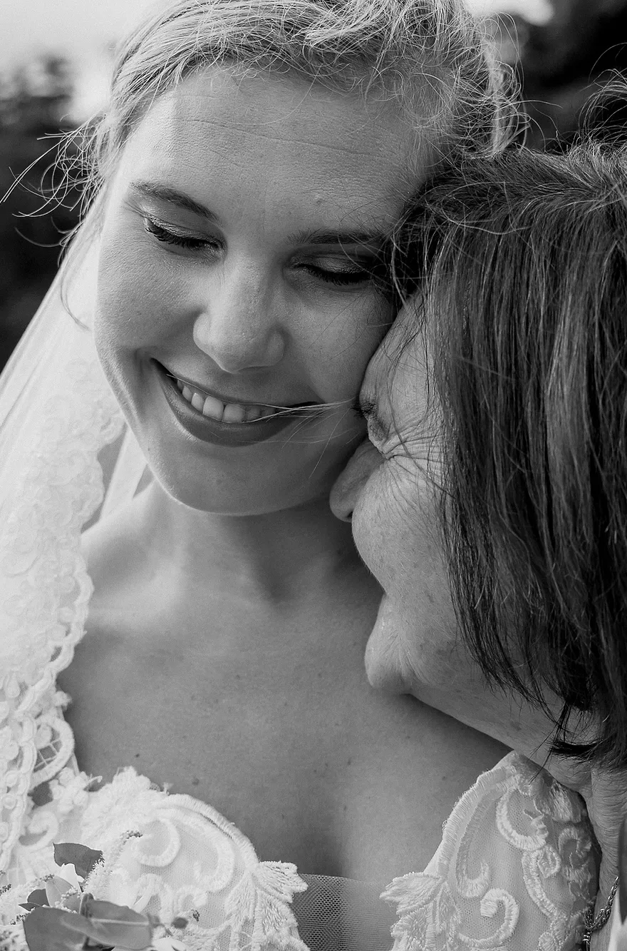Bride and her mother, vertical close-up