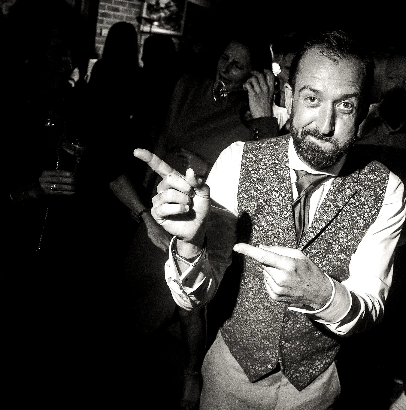 Hand with raised finger pointing left · groom